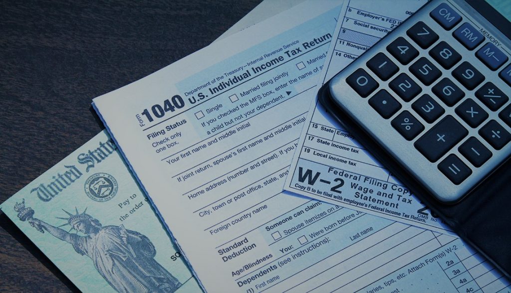 Tax forms and a U.S. Treasury check