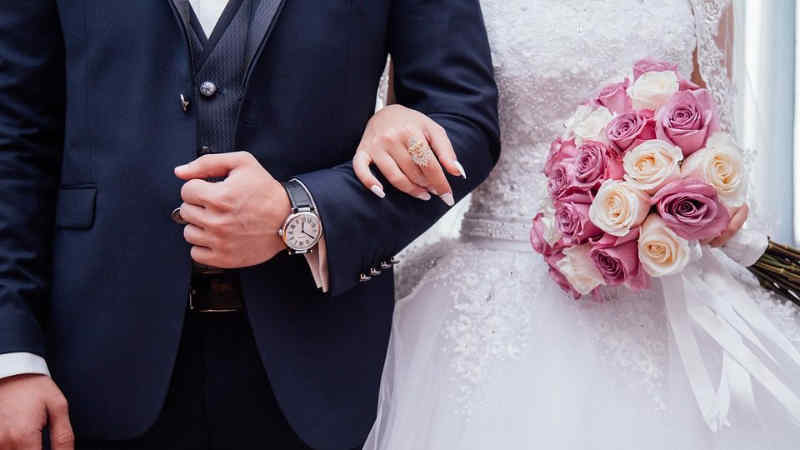 Bride and Groom Arm in Arm